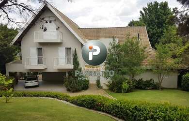 Imagem: A casa possui 4 Dormitórios, 4 Suítes, 6 Banheiros, 3 Vagas