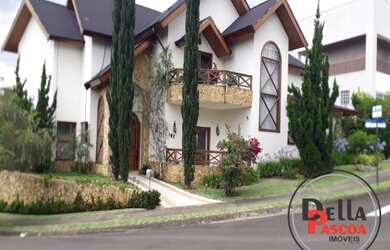 Imagem: A casa em condomínio possui 4 Dormitórios, 4 Suítes, 7 Banheiros