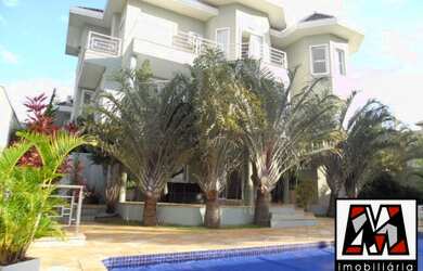 Imagem: A casa em condomínio possui 4 Dormitórios, 4 Suítes, 7 Banheiros