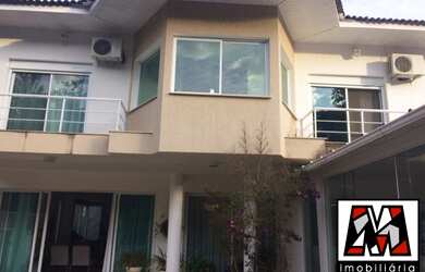 Imagem: A casa em condomínio possui 4 Dormitórios, 4 Suítes, 4 Banheiros