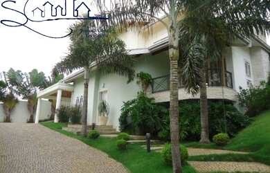 Imagem: A casa possui 5 Dormitórios, 4 Suítes, 7 Banheiros, 4 Vagas