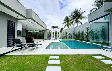 Imagem: A casa possui 5 Dormitórios, 5 Suítes, 6 Banheiros, 4 Vagas