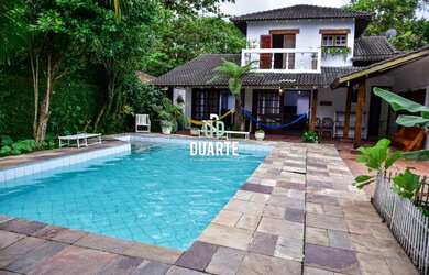 Imagem: A casa possui 7 Dormitórios, 5 Suítes, 7 Banheiros, 5 Vagas