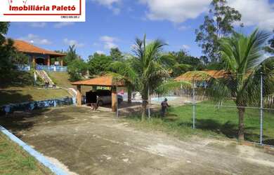 Imagem: A chácara possui 4 Dormitórios, 1 Suíte, 4 Banheiros, 2.000m²