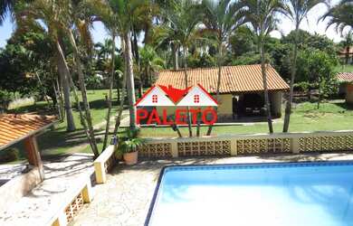 Imagem: A chácara possui 3 Dormitórios, 1 Suíte, 4 Banheiros, 3 Vagas