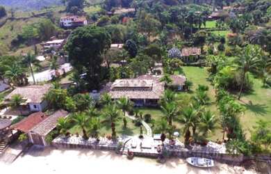 Imagem: A casa possui 7 Dormitórios, 4 Suítes, 8 Banheiros e 10 Vagas