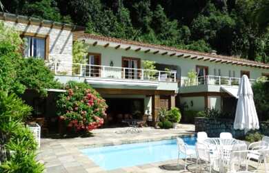 Imagem: A casa em condomínio possui 5 Dormitórios, 5 Suítes, 7 Banheiros