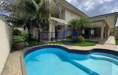 Imagem: A casa possui 4 Dormitórios, 4 Suítes, 4 Vagas na garagem