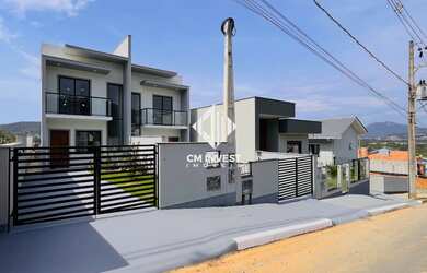 Imagem: A casa possui 2 Dormitórios, 2 Suítes, 1 Banheiro, 2 Vagas