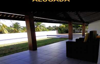 Imagem: A casa em condomínio possui 5 Dormitórios, 4 Suítes, 7 Banheiros