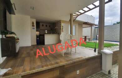 Imagem: A casa em condomínio possui 5 Dormitórios, 5 Suítes, 2 Vagas