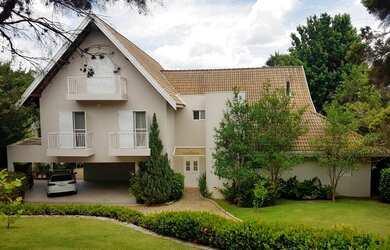 Imagem: A casa em condomínio possui 4 Dormitórios, 4 Suítes, 1.825m²