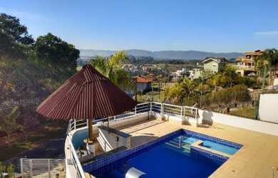 Imagem: A casa em condomínio possui 4 Dormitórios, 3 Suítes, 7 Banheiros