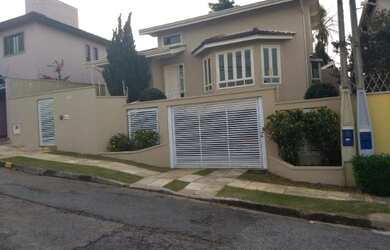 Imagem: A casa possui 2 Dormitórios, 2 Suítes, 4 Banheiros, 4 Vagas