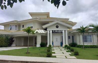 Imagem: A casa em condomínio possui 4 Dormitórios, 5 Banheiros, 6