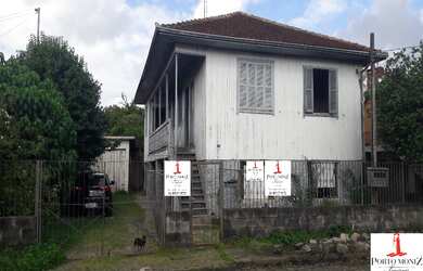 Imagem: A casa possui 2 Dormitórios, 1 Banheiro, 1 Vaga na garagem