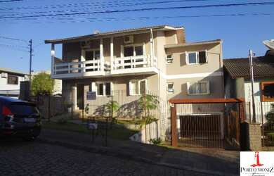 Imagem: A casa e possui 6 Dormitórios, Suítes, 3 Banheiros, 4 Vagas