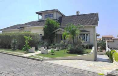 Imagem: A casa em condomínio possui 5 Dormitórios, 5 Suítes, 7 Banheiros