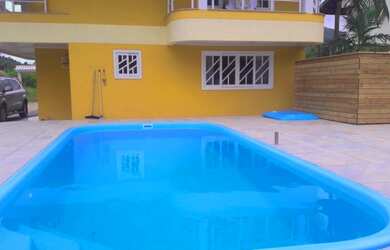 Imagem: A casa possui 3 Dormitórios, 1 Suíte, 4 Banheiros, 3 Vagas