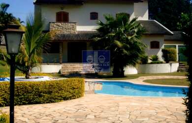 Imagem: A chácara possui 4 Dormitórios, 2 Suítes, 7 Banheiros, 4