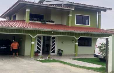 Imagem: A casa possui 3 Dormitórios e está localizado em Praia do