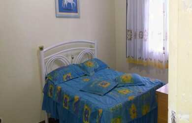 Imagem: A casa possui 3 Dormitórios, 1 Suíte, 2 Banheiros, 7 Vagas