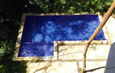 Imagem: A casa em condomínio possui 5 Dormitórios, 5 Suítes, 6 Banheiros