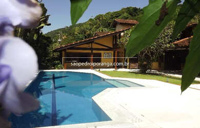 Imagem: A casa em condomínio possui 5 Dormitórios, 5 Suítes, 7 Banheiros