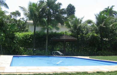 Imagem: A casa em condomínio possui 6 Dormitórios, 5 Suítes, 8 Banheiros