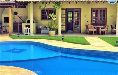 Imagem: A casa em condomínio possui 5 Dormitórios, 5 Suítes e 6 Vagas