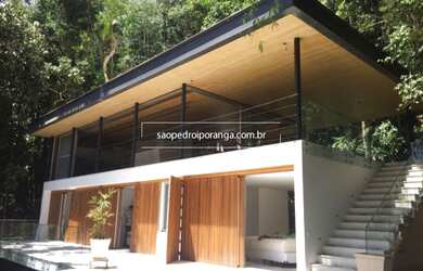 Imagem: A casa em condomínio possui 4 Dormitórios, 4 Suítes, 5 Banheiros