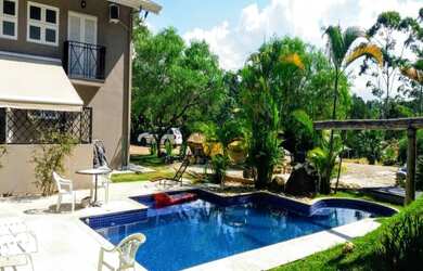 Imagem: A chácara possui 4 Dormitórios, 4 Suítes, 3 Banheiros, 4