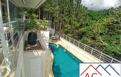 Imagem: A casa possui 5 Dormitórios, 5 Suítes, 3 Banheiros, 4 Vagas