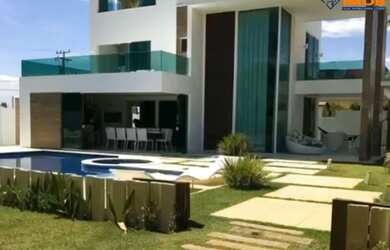 Imagem: A casa em condomínio possui 5 Dormitórios, 5 Suítes, 6 Banheiros