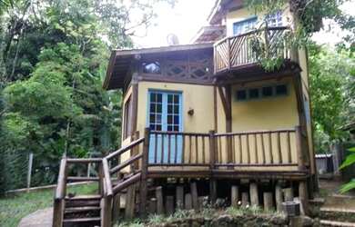 Imagem: A casa à venda possui 2 Dormitórios, 1 Suíte, 2 Banheiros