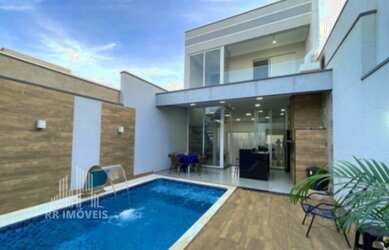 Imagem: A casa possui 2 Dormitórios, 1 Suíte, 4 Banheiros, 2 Vagas