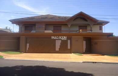 Imagem: A casa possui 5 Dormitórios, 7 Banheiros, 6 Vagas na garagem