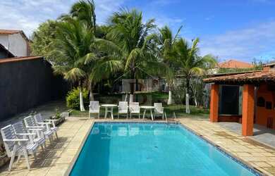 Imagem: A casa possui 5 Dormitórios, 3 Suítes, 5 Banheiros, 4 Vagas