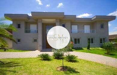 Imagem: A casa em condomínio possui 5 Dormitórios, 5 Suítes, 7 Banheiros