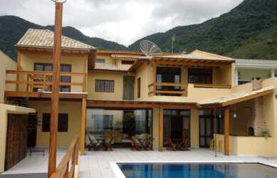 Imagem: A casa possui 5 Dormitórios, 5 Suítes, 6 Banheiros, 6 Vagas