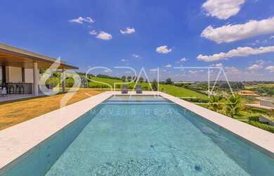 Imagem: A casa possui 6 Dormitórios, 6 Suítes, 8 Banheiros, 8 Vagas