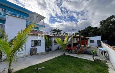 Imagem: A casa possui 2 Dormitórios, 2 Suítes, 3 Banheiros, 4 Vagas