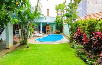 Imagem: A casa possui 5 Dormitórios, 5 Suítes, 7 Banheiros, 4 Vagas