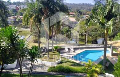 Imagem: A casa em condomínio possui 4 Dormitórios, 4 Suítes, 6 Banheiros