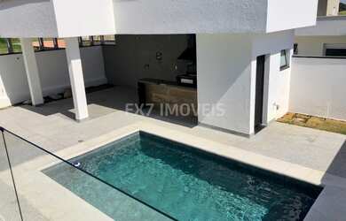 Imagem: A casa em condomínio possui 4 Dormitórios, 4 Suítes, 4 Banheiros