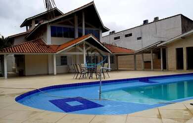 Imagem: A casa possui 5 Dormitórios, 5 Suítes, 6 Banheiros, 5 Vagas