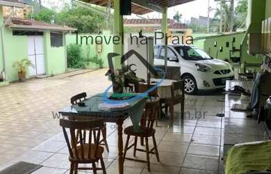 Imagem: A casa possui 2 Dormitórios, 1 Suíte, 1 Banheiro, 3 Vagas