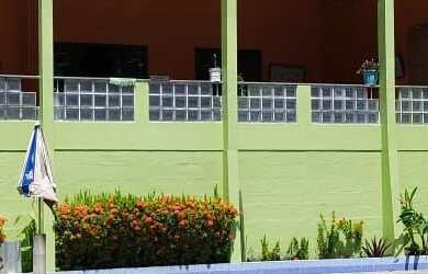 Imagem: A casa possui 2 Dormitórios, 2 Suítes, 1 Banheiro, 5 Vagas