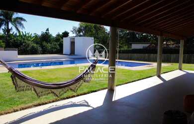Imagem: A casa em condomínio possui 5 Dormitórios, 3 Suítes, 10 Banheiros