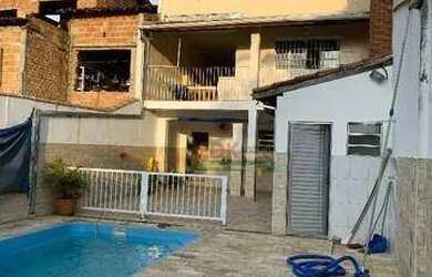 Imagem: A casa possui 3 Dormitórios, 4 Banheiros, 3 Vagas na garagem